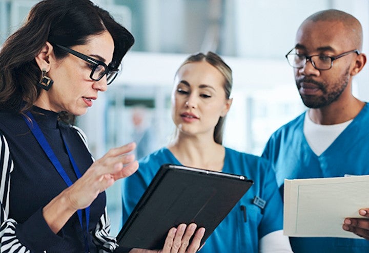 business and healthcare workers working together