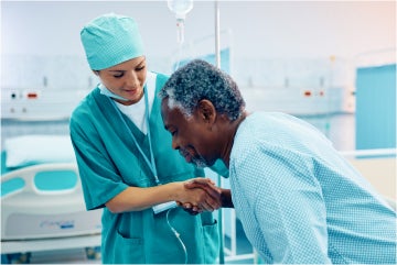 Female nurse helping patient
