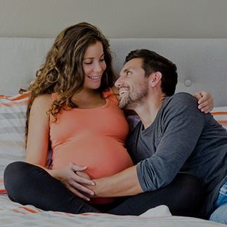 A man hugging his pregnant wife