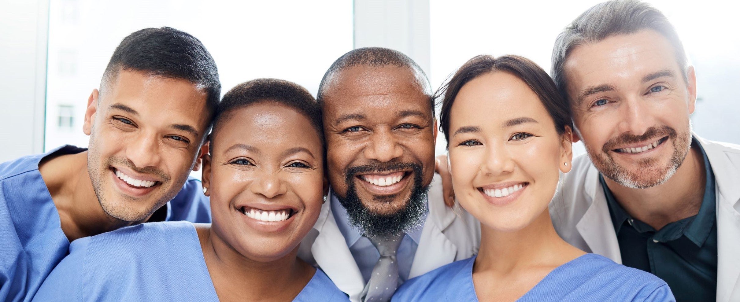 Doctors and nurses smiling