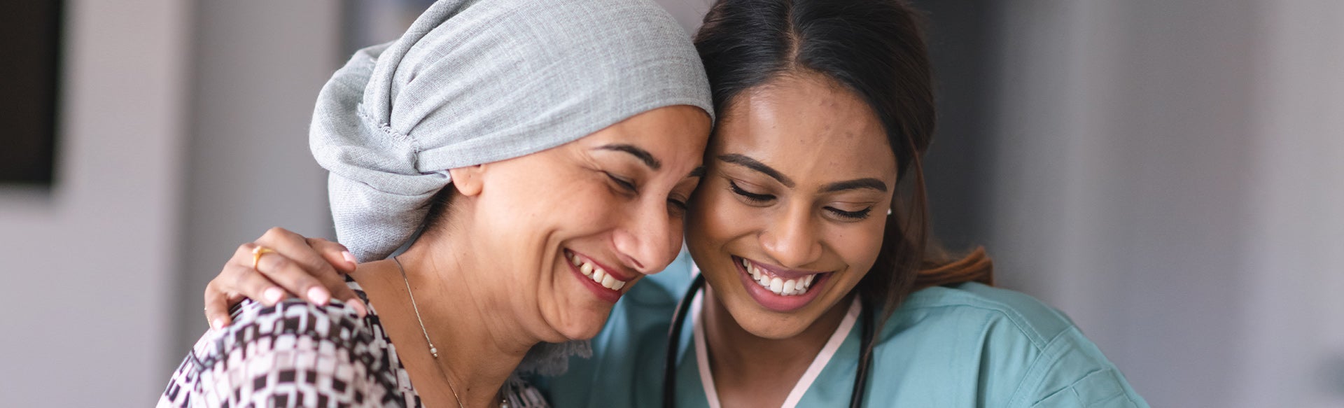 Nurse and patient smiling